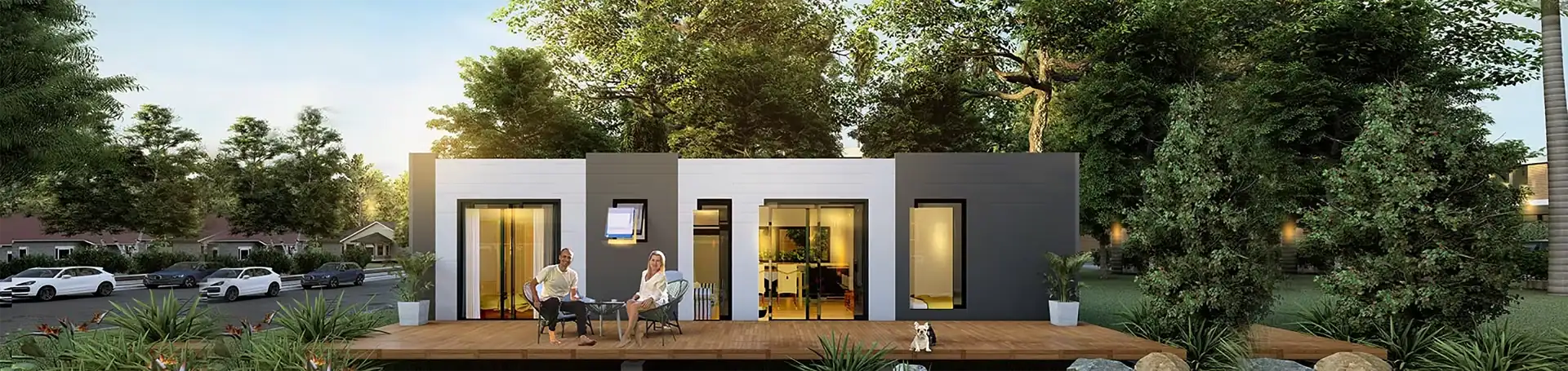 Foldable modular home exterior at dusk with warm lighting and modern steel structure